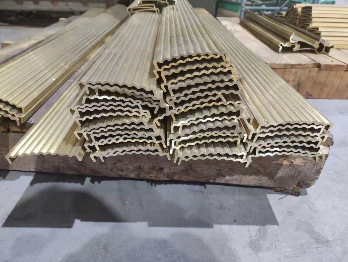 Finished extruded brass profiles and tubes at Cymber Metal warehouse